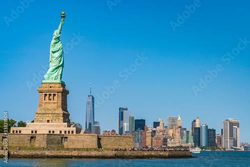 The statue of Liberty  with blue sky background. © checubus
