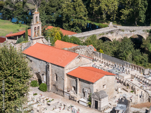 View of St. Mary of Vilanova Church and the romanesque Vilanova bridge in Allariz, province of Ourense, Galicia, Spain photo