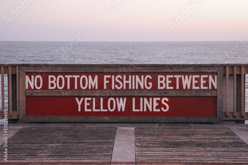 sign on fishing pier