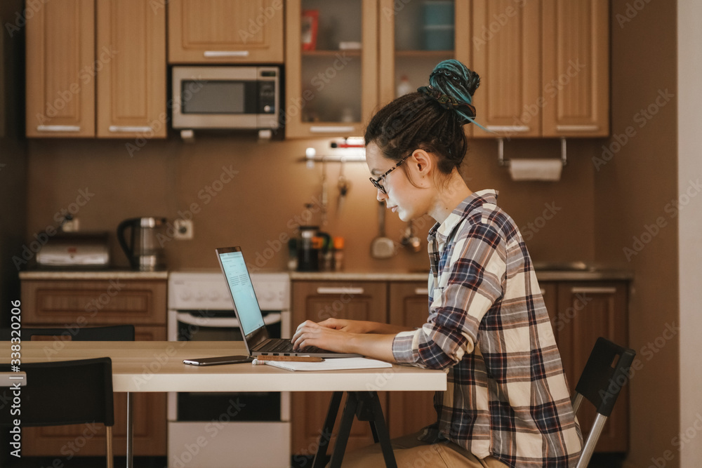 Home schooling online. Girl student takes online courses. Home schooling online. Girl student takes online courses.