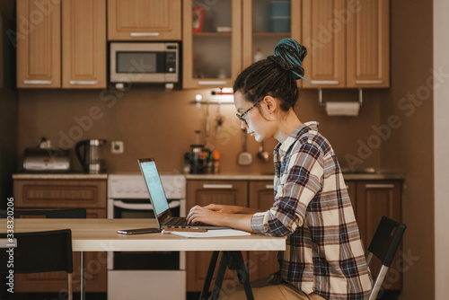 Home schooling online. Girl student takes online courses.