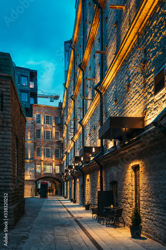 Tallinn, Estonia. Historical Rotermann City Quarter In Evening Illuminations. Rotermann Quarter Includes Old Industrial Buildings With New Function And Modern Architecture photo