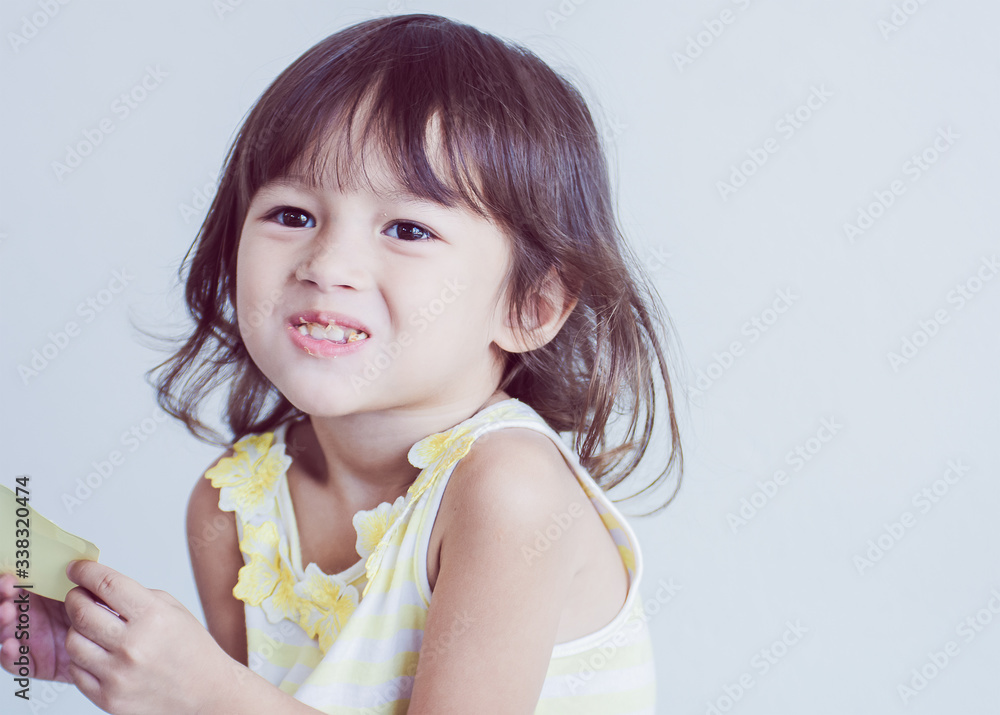 Little girl smiling and eating Little girl smiling and eating