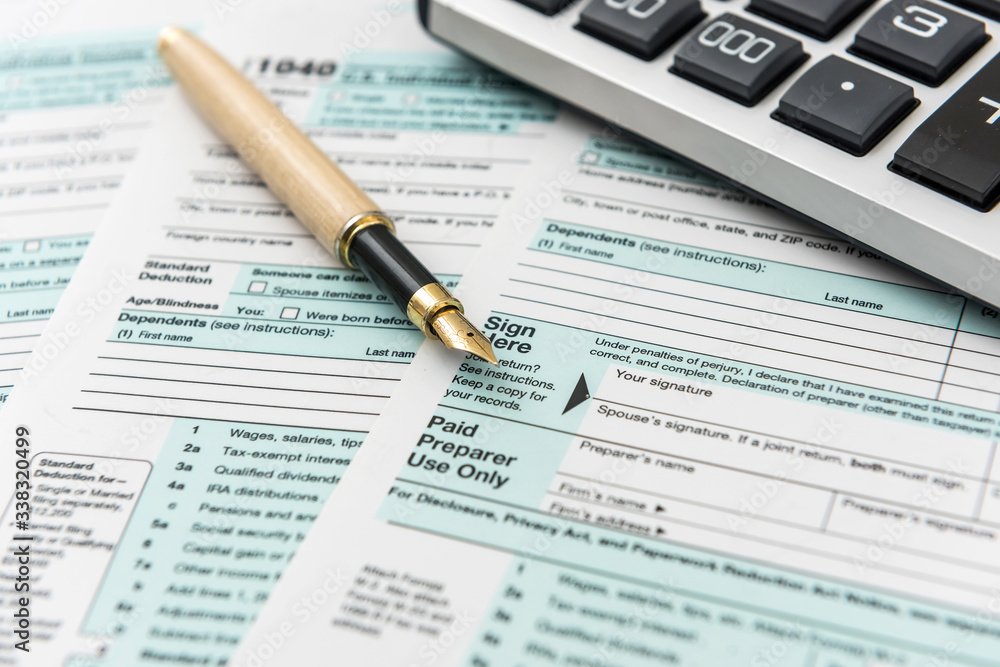 1040 tax form with pen, finance document 1040 tax form with pen, finance document