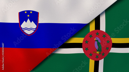 The flags of Slovenia and Dominica. News, reportage, business background. 3d illustration photo