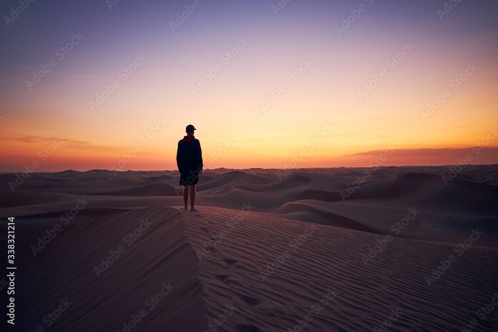 Lonely man in the middle of desert