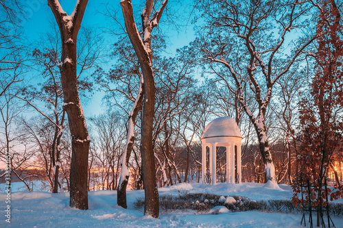 Gomel, Belarus. City Park In Winter Night. Gazebo In Park. Garden Pergola In Snow