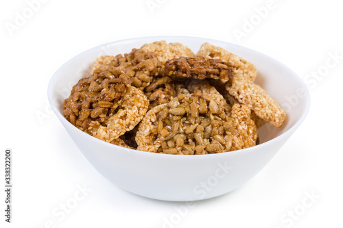 Round sesame and sunflower seed candies in the white bowl