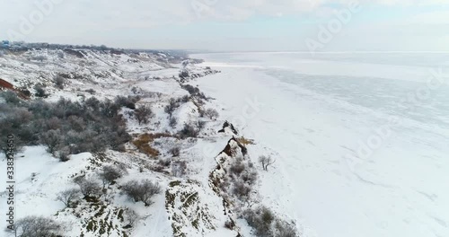 frozen sea and coastline in the snow, aerial photography photo