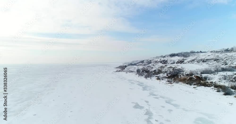 frozen sea and coastline in the snow, aerial photography frozen sea and coastline in the snow, aerial photography