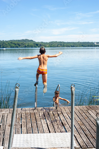  children dive into the water from pier