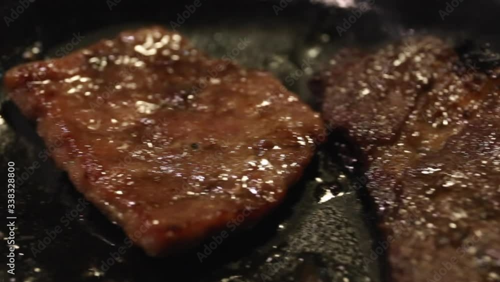 Japanese beef grill on metal pan close up and pan shot Japanese beef grill on metal pan close up and pan shot