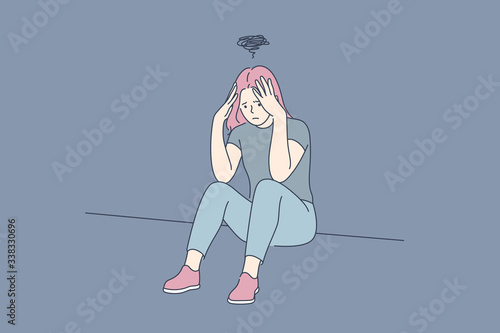 Depression, fatigue, mental stress, frustration concept. Young depression frustrated woman or girl teenager sitting on floor at home. Fatigue, raising of mental stress because of headache or bad news.