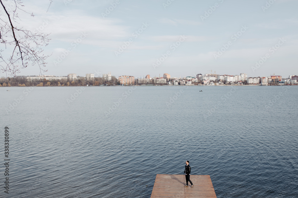 Fototapeta premium Portrait of fashionable well dressed man with beard posing outdoors