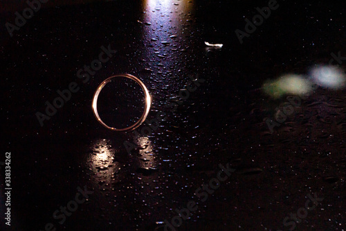 wedding rings on a black background