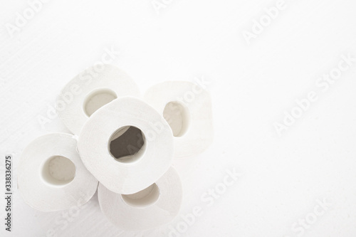 The main commodity during the coronavirus epidemic. Rolls of toilet paper on a white background