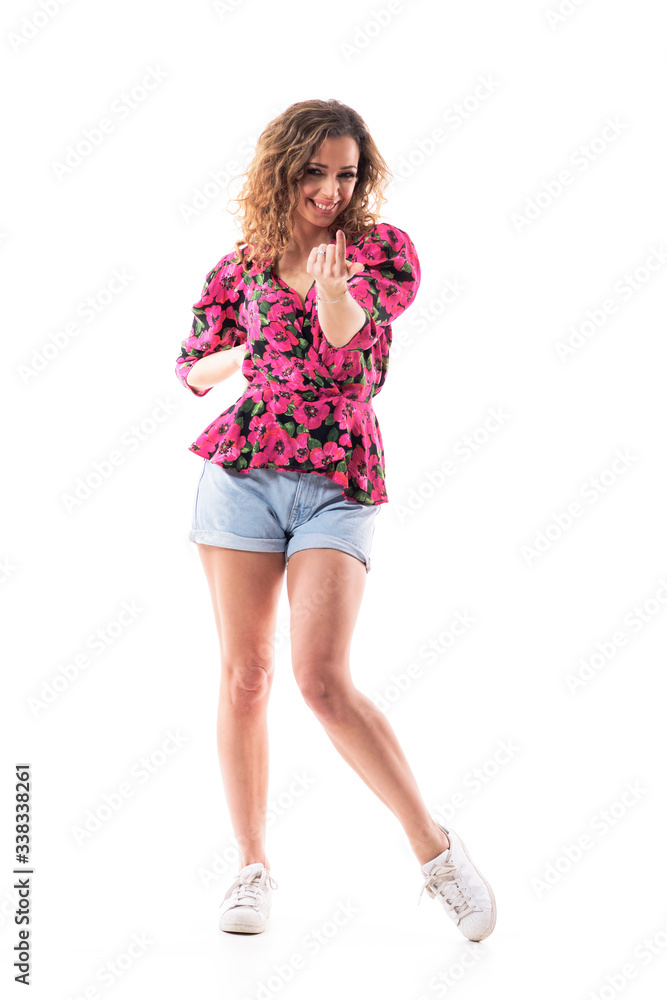 Cheerful smiling cute woman in summer clothes inviting you with finger to join party. Full body isolated on white background. 