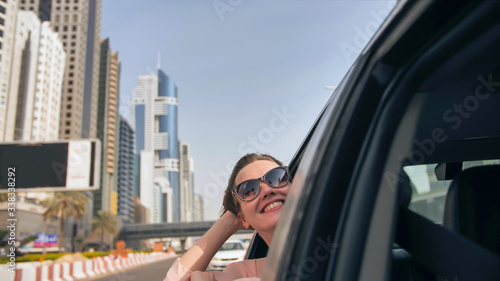 Photography Happy Girl driving a car in Dubai.