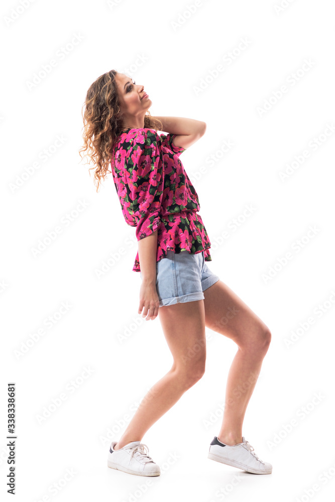 Naklejka premium Side view of young fashionable woman beauty looking up touching neck happy and thoughtful. Full body isolated on white background. 