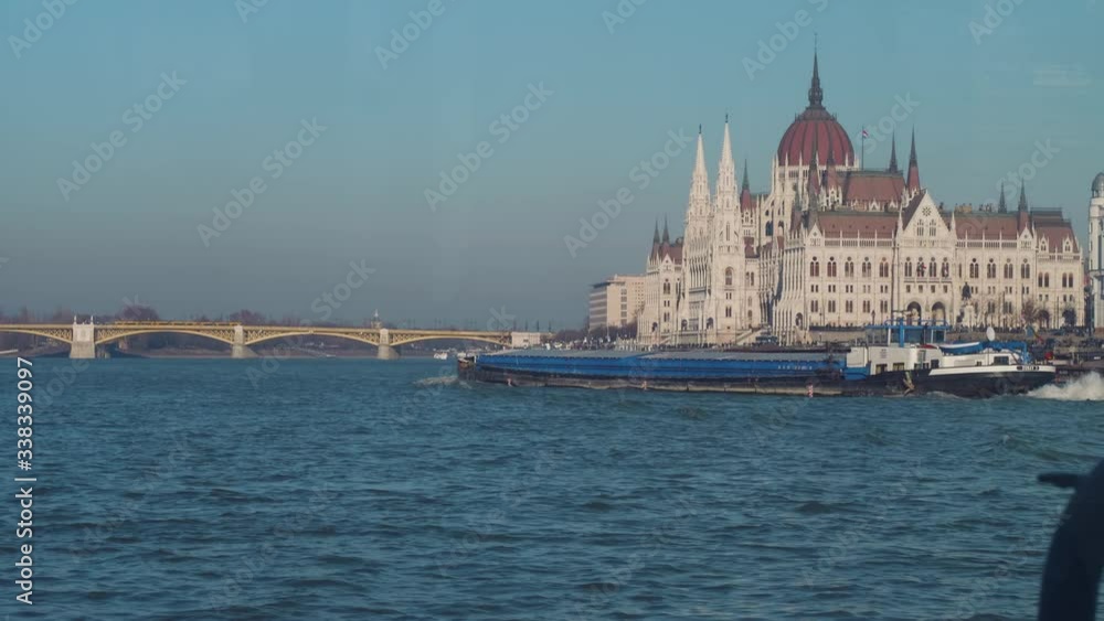 View from water of Hungarian Parliament Building from window of moving ship View from water of Hungarian Parliament Building from window of moving ship