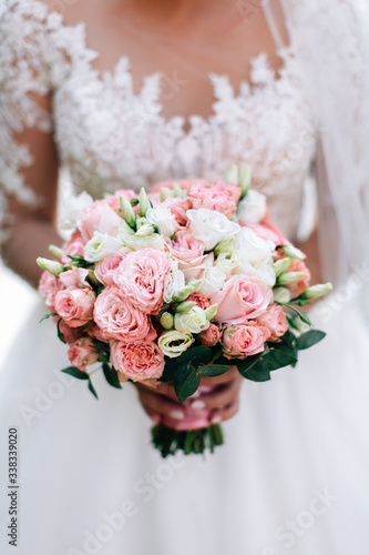 Bride in white wedding dress holding bouquet © Oleksandr Blishch