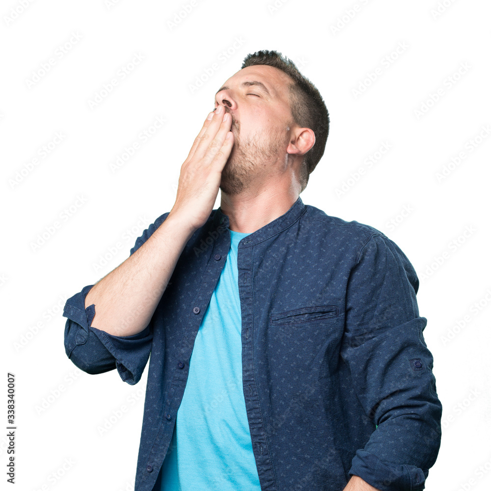 Young man wearing a blue outfit. Looking sleepy. Young man wearing a blue outfit. Looking sleepy.