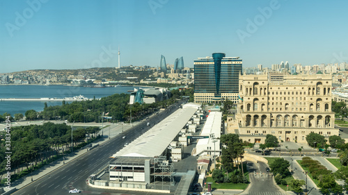 Baku, Azerbaijan - July 2019: Baku cityscape with Caspian Sea, Flame Towers and car traffic