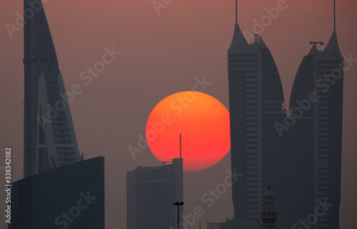  Sunset behind the iconic buildings of Bahrain