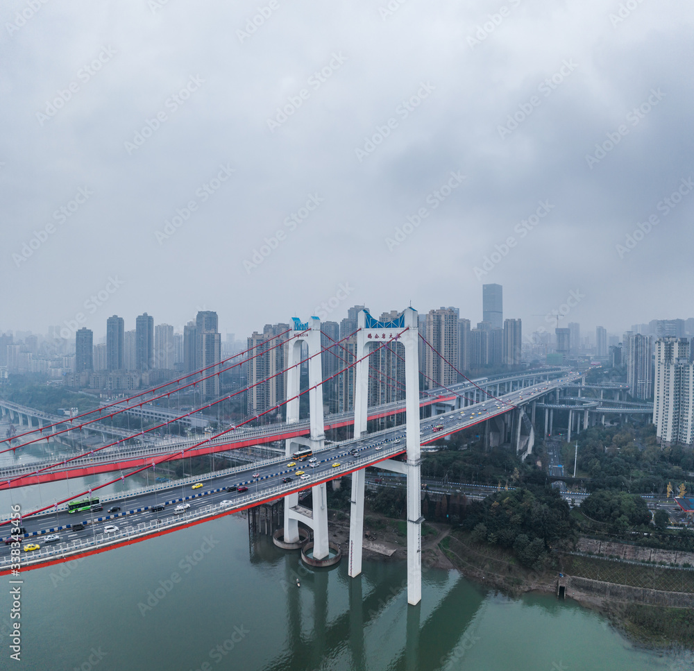 Aerial drone shot of E'gongyan bridge by Jialing river  in Chongqing, southwest China