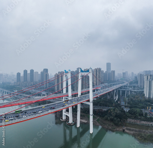 Aerial drone shot of E'gongyan bridge by Jialing river  in Chongqing, southwest China © Davidzfr