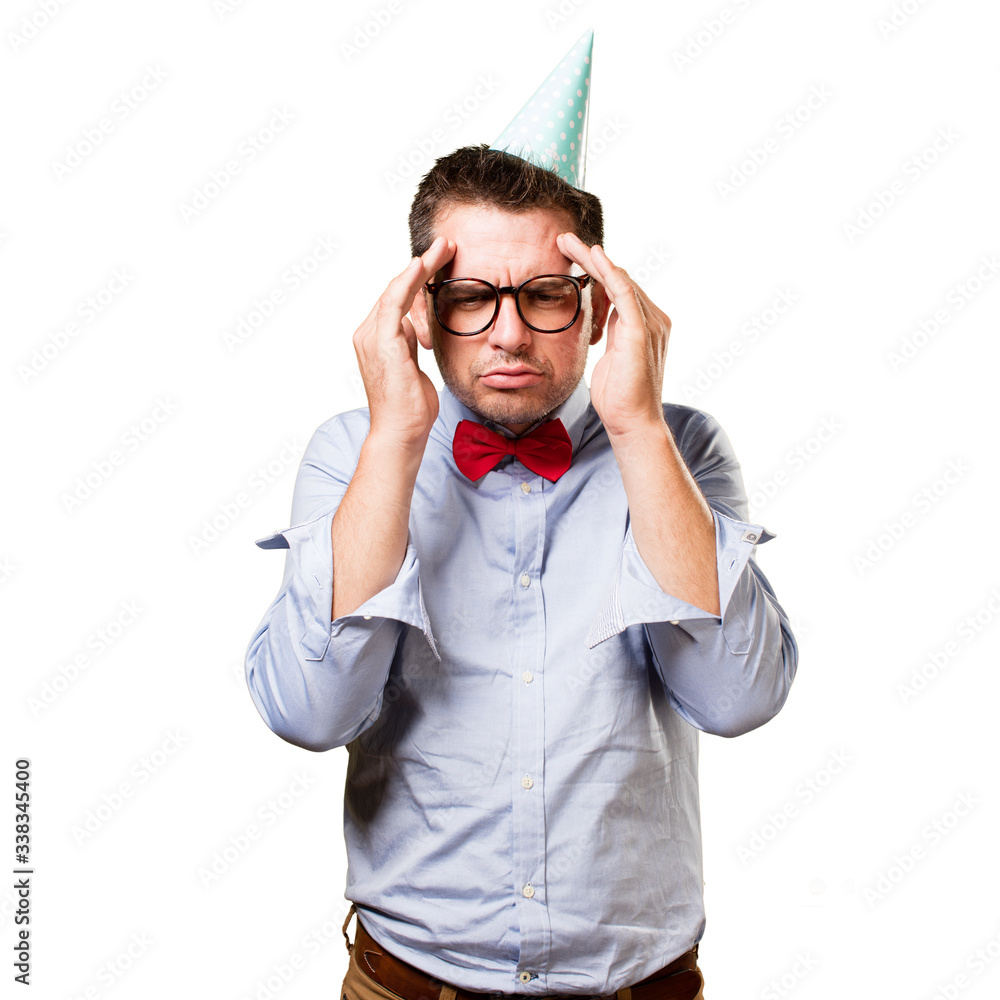 Man wearing a red bow tie and party hat. Looking in a deep thinking. Man wearing a red bow tie and party hat. Looking in a deep thinking.