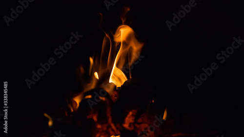 Red fiery figures on black background