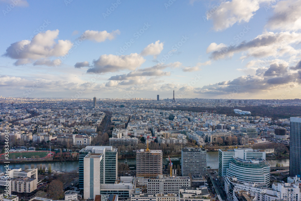 Aerial drone shot of Levallois Paris with Eiffel Tower tour montparnasse, jardin d'acclimation from La Defense area
