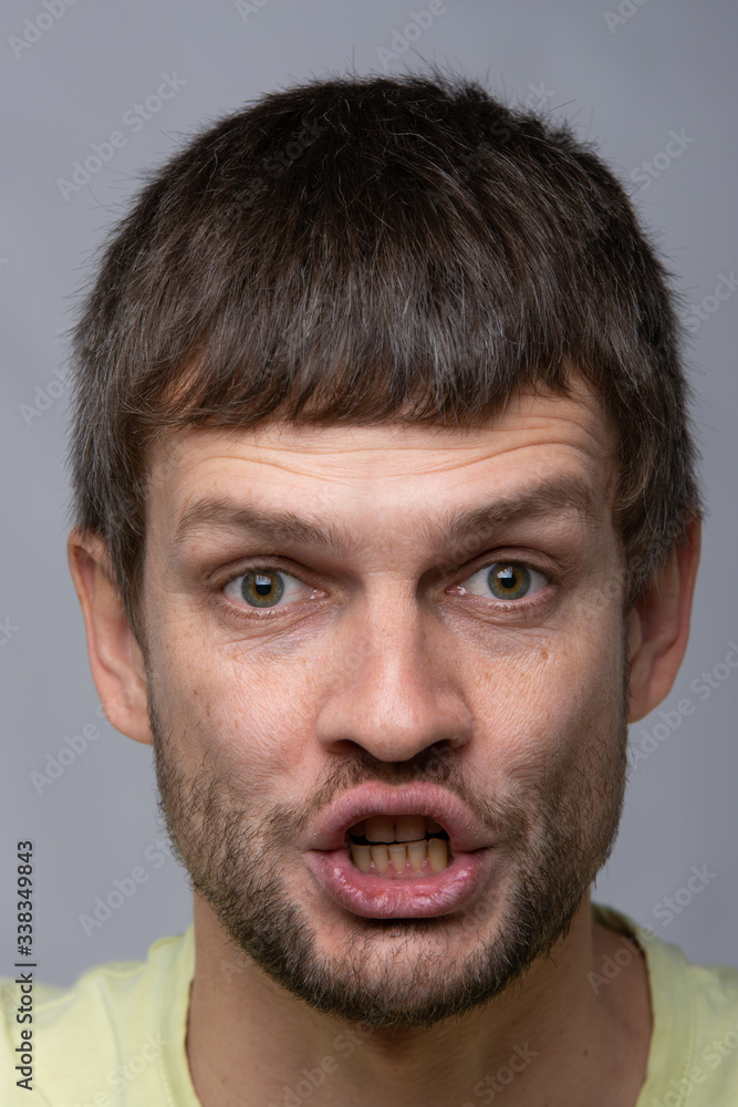 Closeup portrait of a talking man of European appearance Closeup portrait of a talking man of European appearance