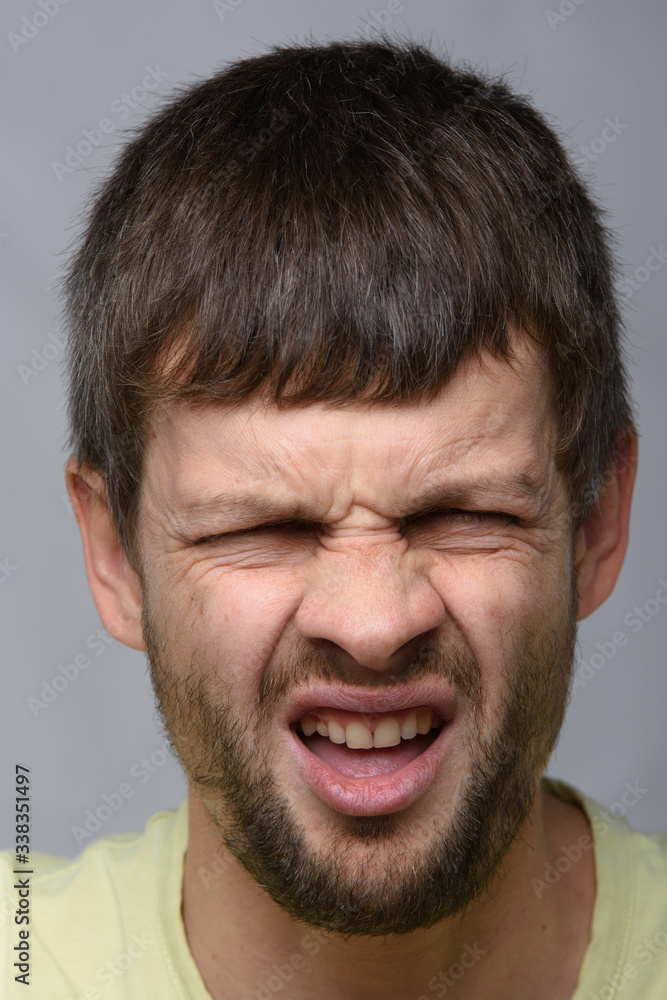 Portrait of a man who smelled, European appearance and close-up Portrait of a man who smelled, European appearance and close-up