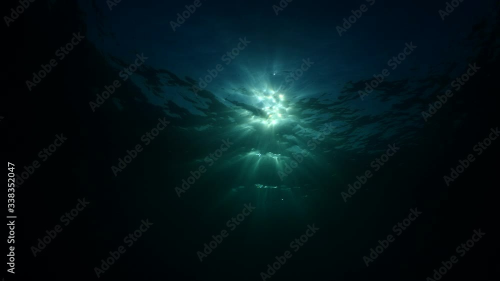 sun ray and sun beam scenery underwater waves on surface of water slow ocean scenery