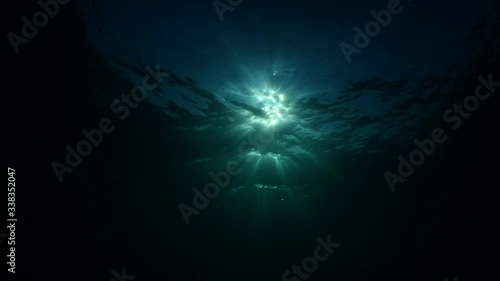 sun ray and sun beam scenery underwater waves on surface of water slow ocean scenery