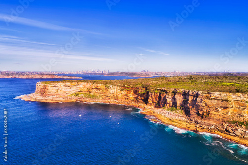 Canvas Print D North Head cliff from sea blue