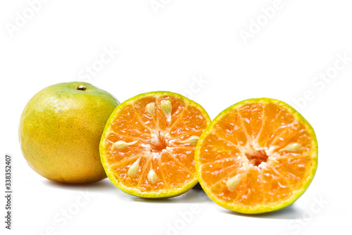 Orange cut in half on white