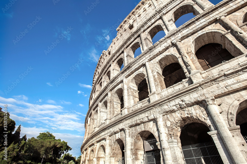 Exterior view of the four tiers and distinctive arches of the Roman Colosseum