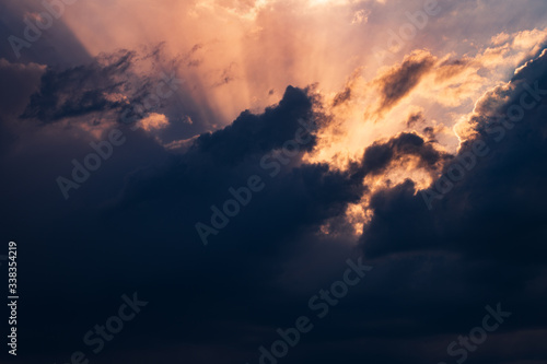 Fototapeta Naklejka Na Ścianę i Meble -  Dramatic Sunset in the clouds with lightbeams shining through