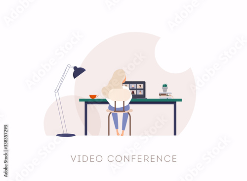 Woman talking to her colleagues in Teleconference. Outbreak display on screen.