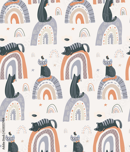 Vector seamless pattern with cute cats on rainbow in simple flat style