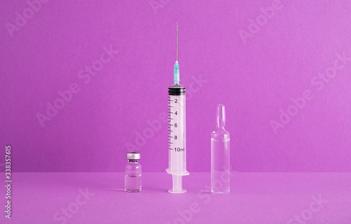 Syringe and dwo vials photo