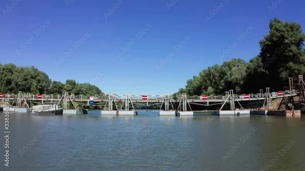 Pontoon wooden bridge over the Tisza river, aerial shot in summer Csongrad, Hungary.
