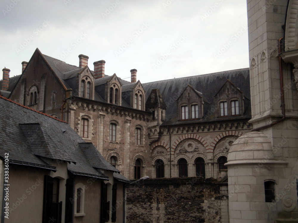 Angers, France - March 15th 2013 : Focus on the episcopal palace (Le palais du Tau), located next to the Saint-Maurice cathedral. It was built in the 12th century.