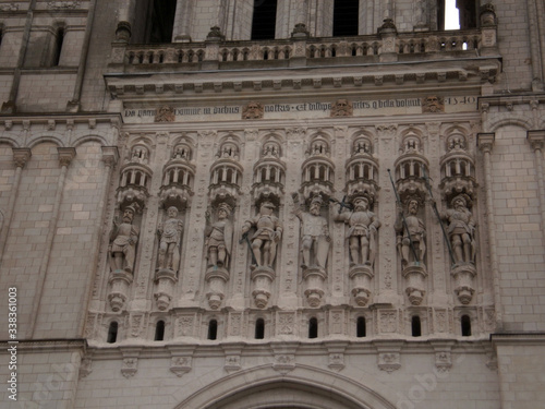 Angers, France - March 15th 2013 : detail of the facade of the cathedral Saint-Maurice. Focus on statues on the main facade.