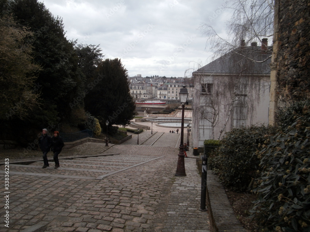 Angers, France - March 15th 2013 : View of the Montée Saint-Maurice, in front of the Cathedral of the city. 