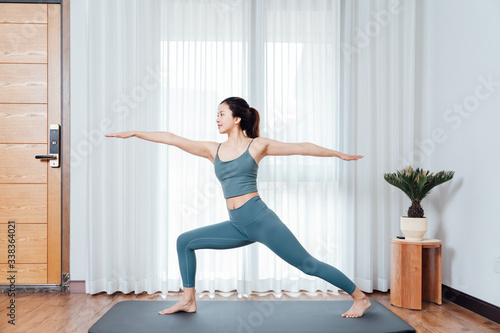 young asian beauty woman doing yoga at home