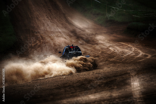 Φωτογραφία Racing sports car in dust clubs on the track , rally